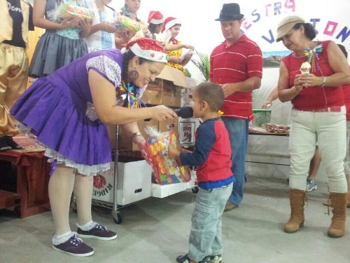 Christmas party. One of the kids recieving a present.